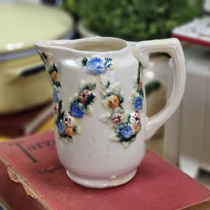 Beautiful Stoneware Pitcher with Raised Foral Garland