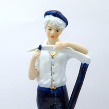 Load image into Gallery viewer, Vintage Porcelain Figurine Boy Sharpening Scythe Blue White Gold Light Academia