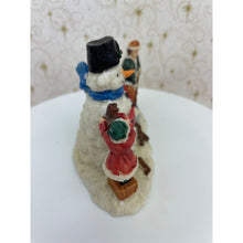 Load image into Gallery viewer, Snowman Figurine - Children Building a Snowman Holding a Merry Christmas Banner