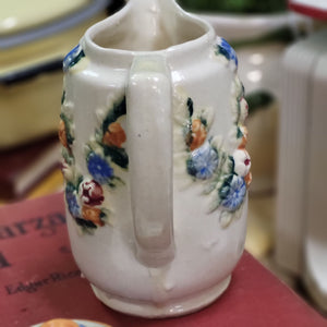 Beautiful Stoneware Pitcher with Raised Foral Garland