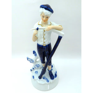 Vintage Porcelain Figurine Boy Sharpening Scythe Blue White Gold Light Academia
