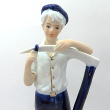 Load image into Gallery viewer, Vintage Porcelain Figurine Boy Sharpening Scythe Blue White Gold Light Academia