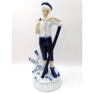 Vintage Porcelain Figurine Boy Sharpening Scythe Blue White Gold Light Academia