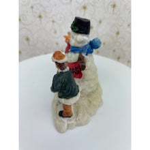 Load image into Gallery viewer, Snowman Figurine - Children Building a Snowman Holding a Merry Christmas Banner