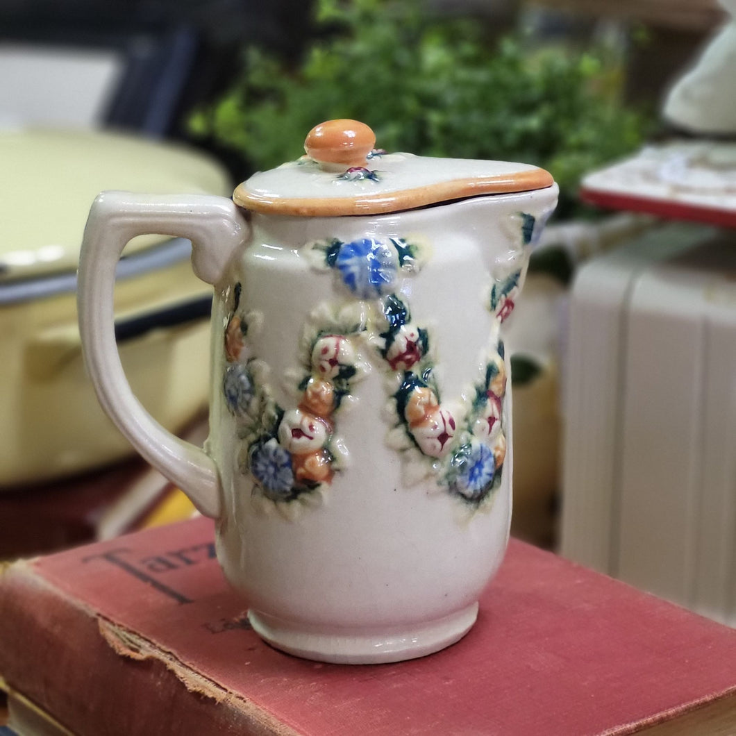 Beautiful Stoneware Pitcher with Raised Foral Garland