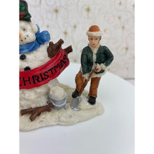 Load image into Gallery viewer, Snowman Figurine - Children Building a Snowman Holding a Merry Christmas Banner