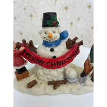 Load image into Gallery viewer, Snowman Figurine - Children Building a Snowman Holding a Merry Christmas Banner