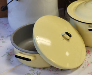 Enamelware lined yellow and gray pot with cover
