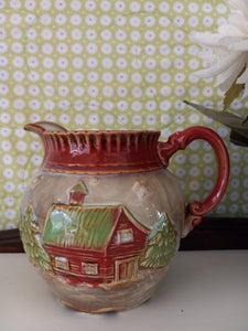 Winter Scene Pitcher with Embossed Log Cabin and Pine Trees