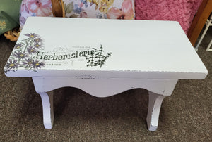 Painted vintage stool with herb decor