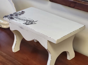 Painted vintage stool with herb decor