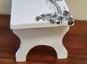 Painted vintage stool with herb decor